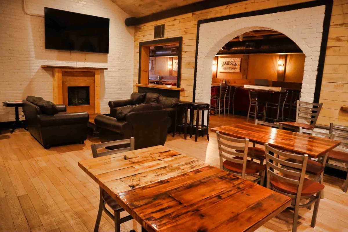 Private event space with fireplace and arch doorway